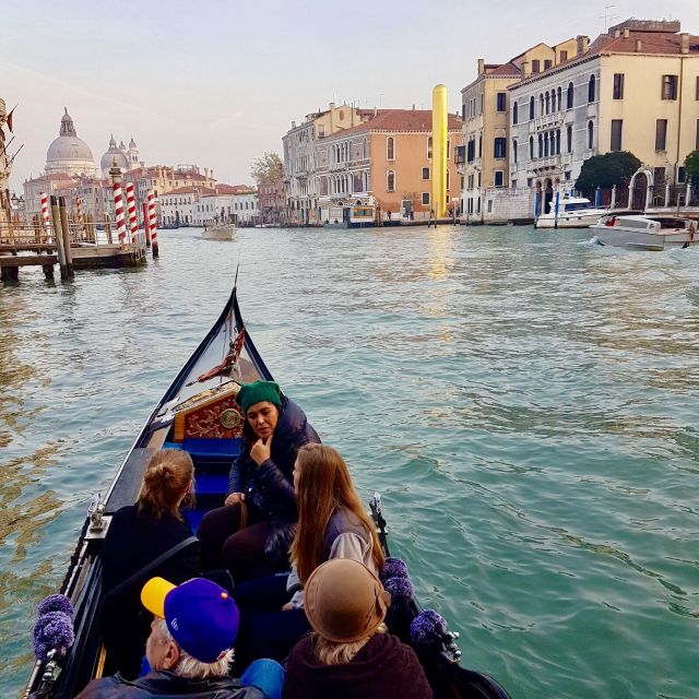 Venice: 30 min Gondola Ride on the Grand Canal with Guide - Palazzo Grassi, the Grand Canal pass, and the major landmark rundown